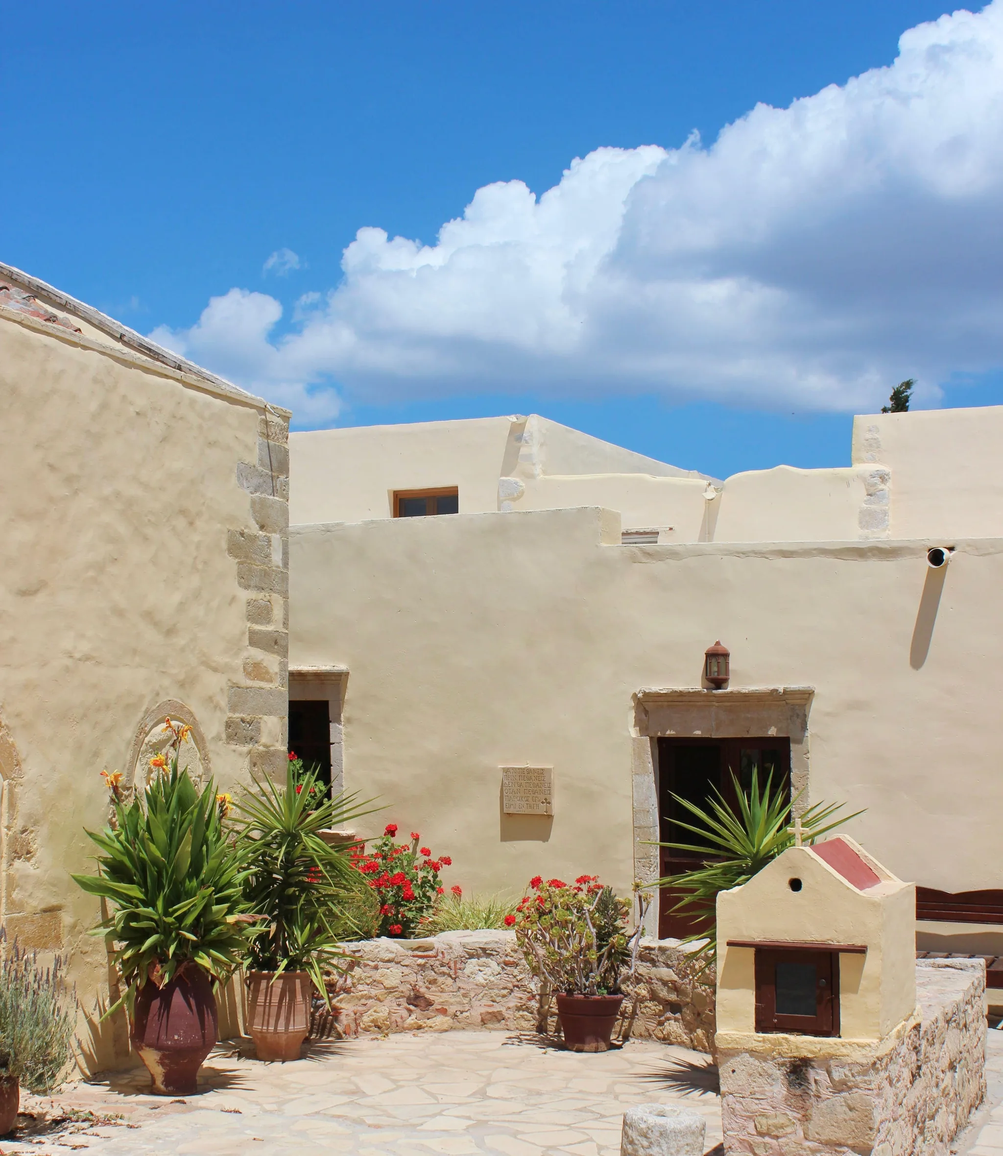 A whitewashed monastery courtyard on the south coast