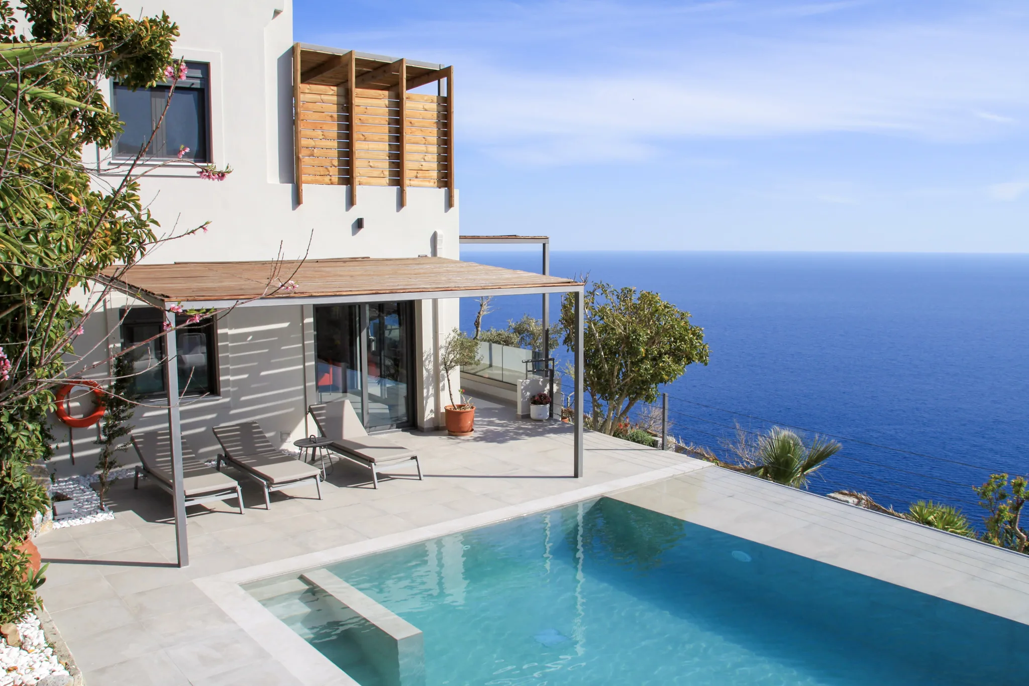 The Anemos villas and pool above the sea